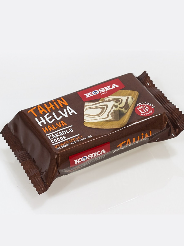 Купить на CrossVill турецкую тахинную халву Koska Kakaolu Cocoa (весом 500 г) с какао в коричневой упаковке с мраморным узором десерта.